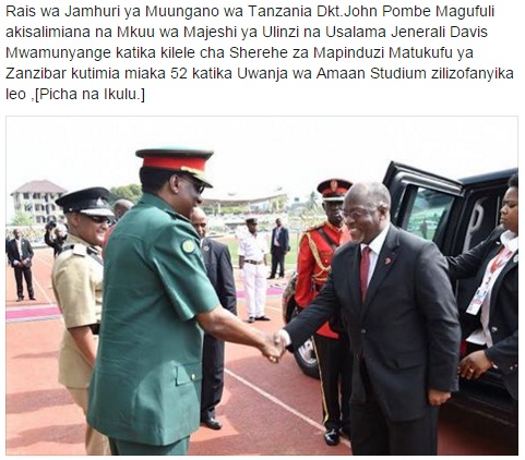 Chief of Tanzania Defence Forces Davis Mwamunyange welcomes Tanzania President John Pombe Magufuli at the ceremony in Zanzibar