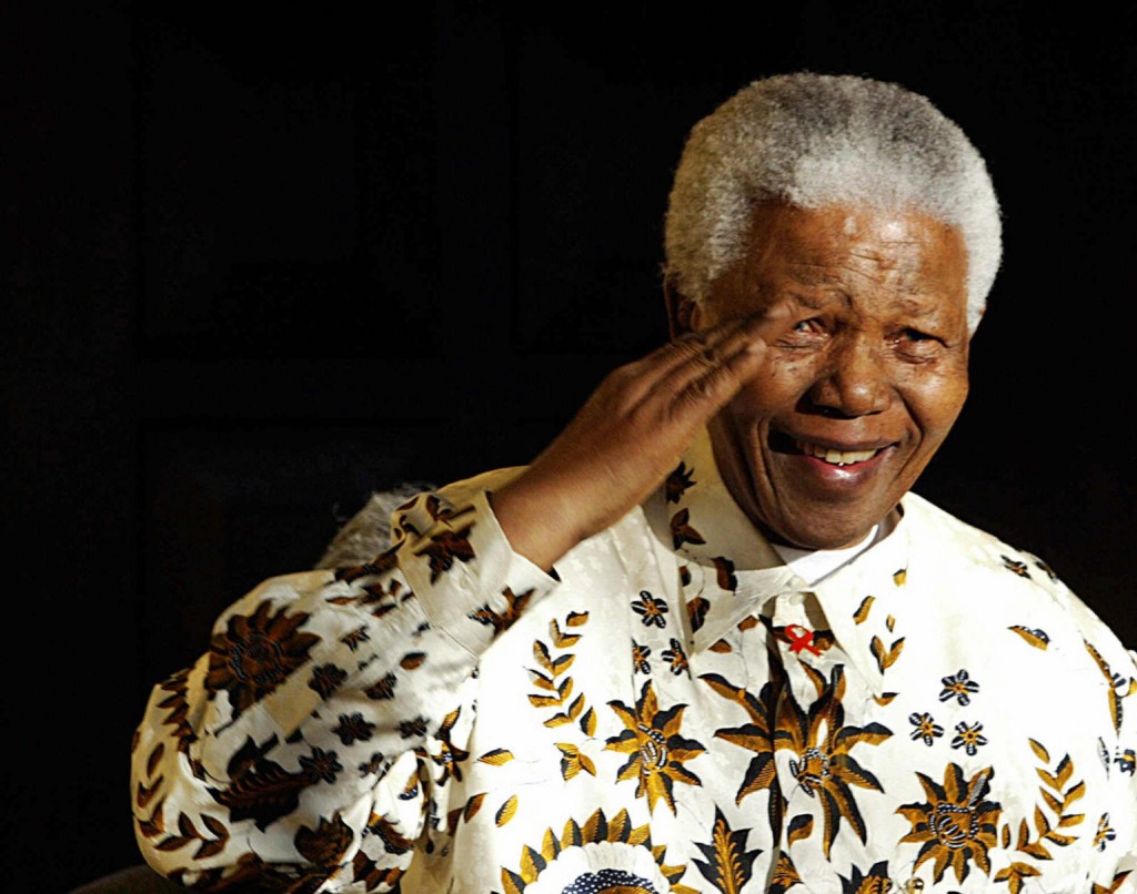 Nelson Mandela, the former South Africa President salutes the South African military health service band that came to play a specially composed march and happy birthday on his 85th birthday, 18 July 2003. AFP PHOTO/ ALEXANDER JOE (Photo credit should read ALEXANDER JOE/AFP/Getty Images)